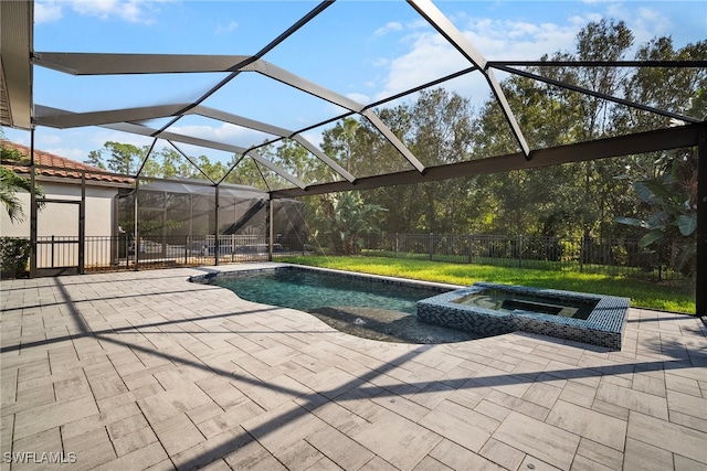 view of pool featuring a patio, an in ground hot tub, and glass enclosure