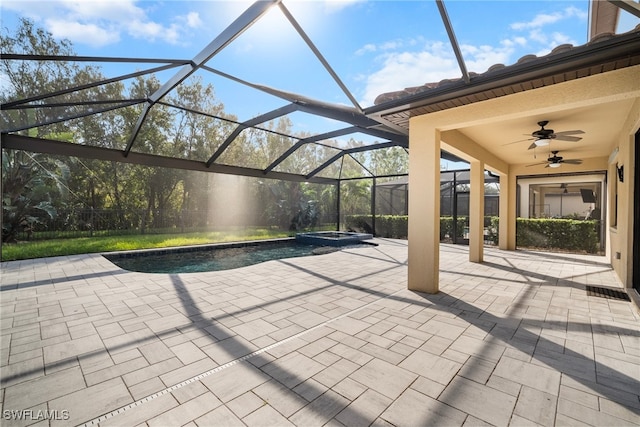 view of patio with a pool with hot tub, a lanai, and ceiling fan