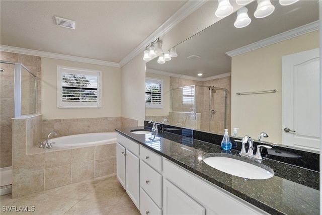 bathroom featuring vanity, crown molding, shower with separate bathtub, and tile patterned floors