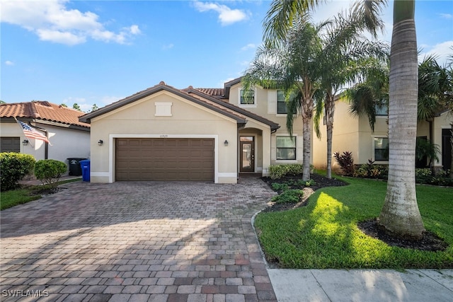 mediterranean / spanish-style home with a front yard and a garage