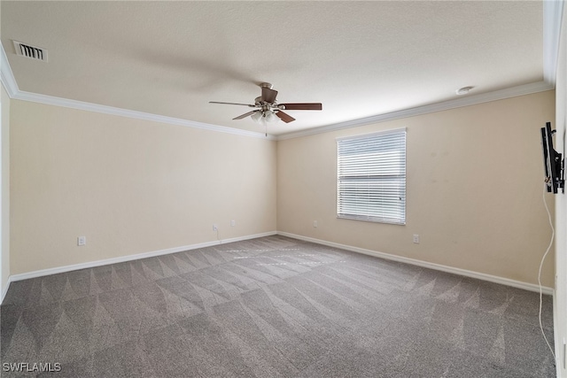 carpeted empty room featuring crown molding, a textured ceiling, and ceiling fan