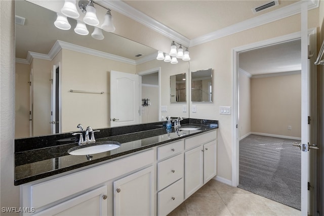 bathroom with vanity, crown molding, and tile patterned flooring