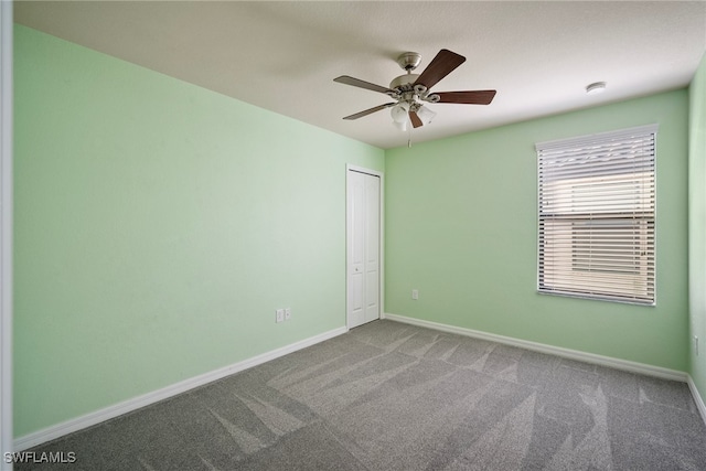 carpeted empty room with ceiling fan