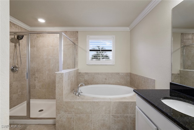 bathroom featuring vanity, ornamental molding, and separate shower and tub