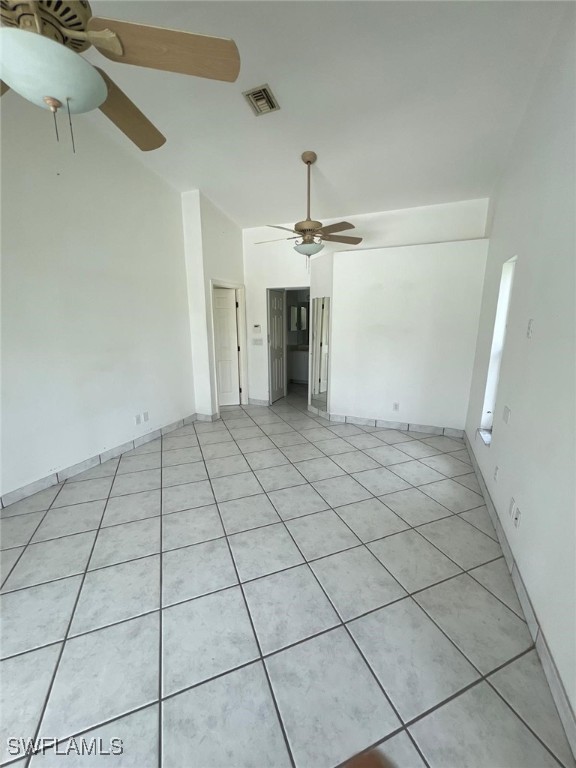 unfurnished living room with light tile patterned flooring