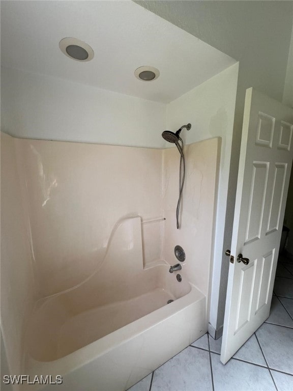 bathroom with shower / bath combination and tile patterned flooring