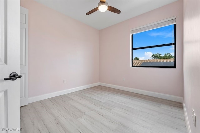 empty room featuring light hardwood / wood-style flooring and ceiling fan