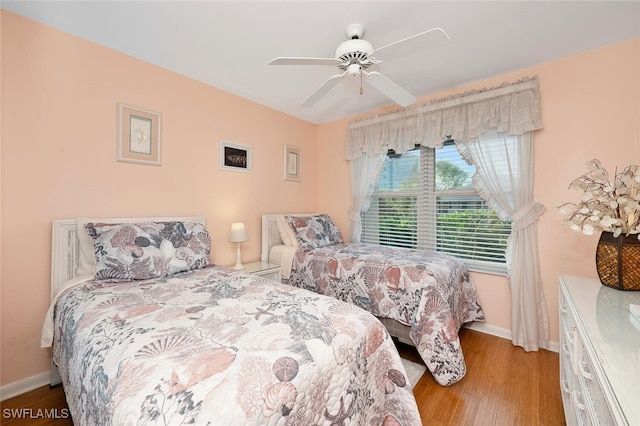 bedroom featuring ceiling fan and light hardwood / wood-style flooring