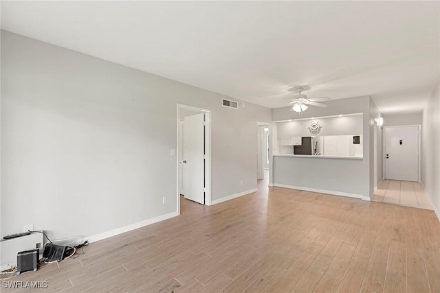 14 Manor Ter Unit 9-106, Marco Island, FL 34145 - unfurnished living room featuring light wood-style floors and ceiling fan