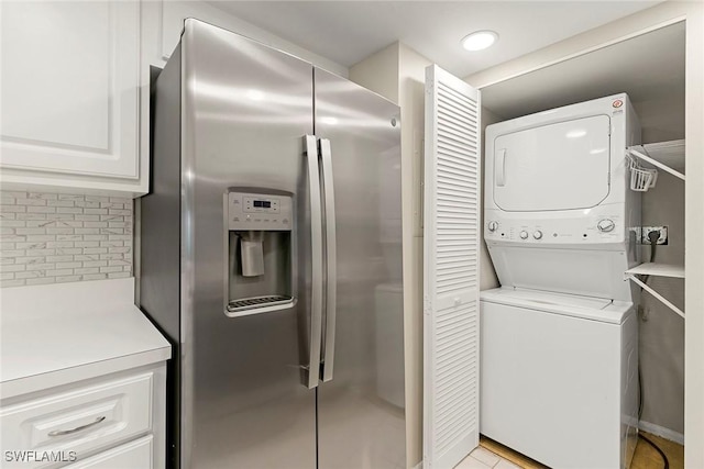14 Manor Ter Unit 9-106, Marco Island, FL 34145 - laundry room with stacked washing machine and dryer