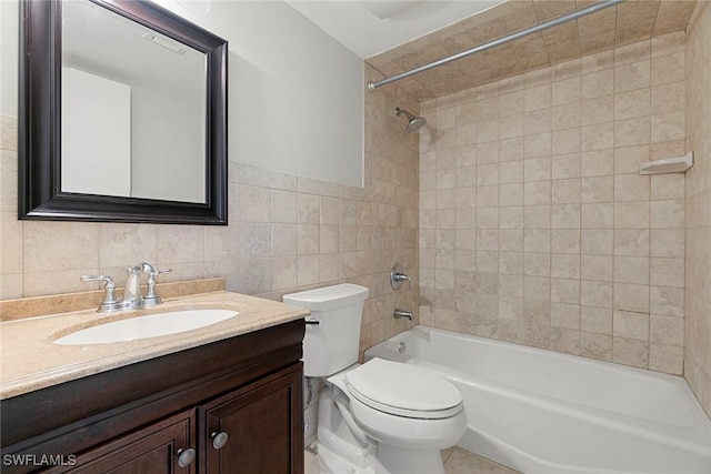 14 Manor Ter Unit 9-106, Marco Island, FL 34145 - bathroom featuring tile walls, shower / bath combination, and vanity