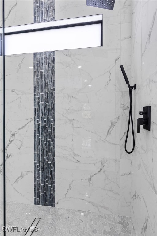 interior space featuring tiled shower