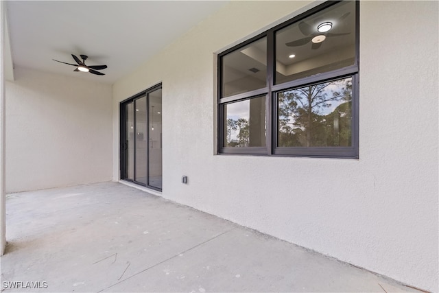 view of patio featuring ceiling fan