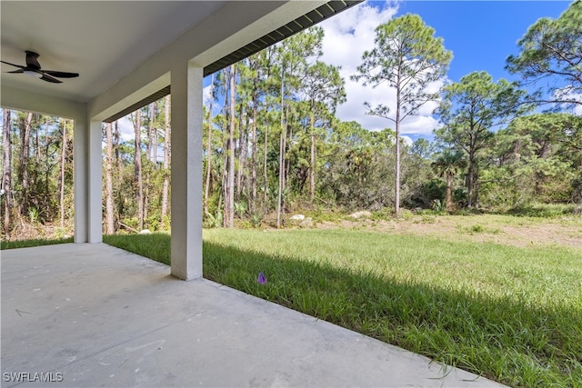 view of yard with a patio and ceiling fan