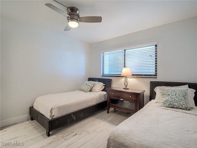 bedroom featuring light hardwood / wood-style floors and ceiling fan