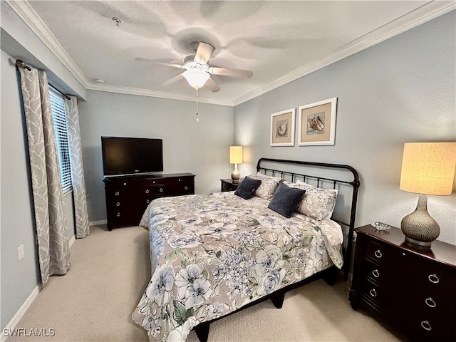 carpeted bedroom with ceiling fan and ornamental molding