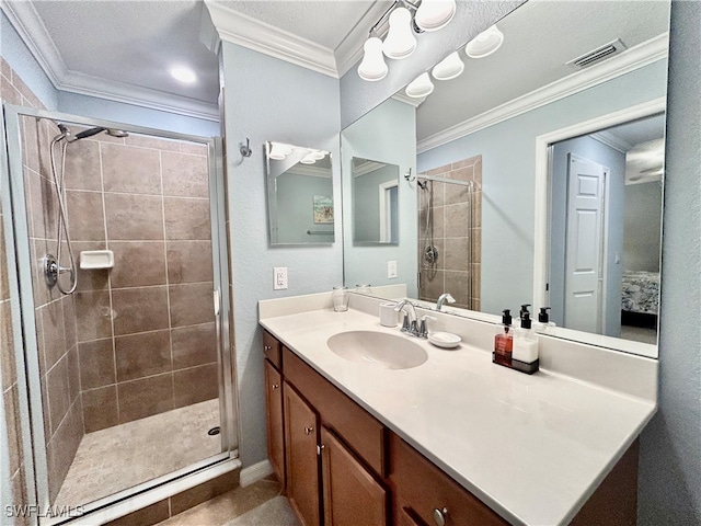 bathroom with vanity, ornamental molding, and walk in shower