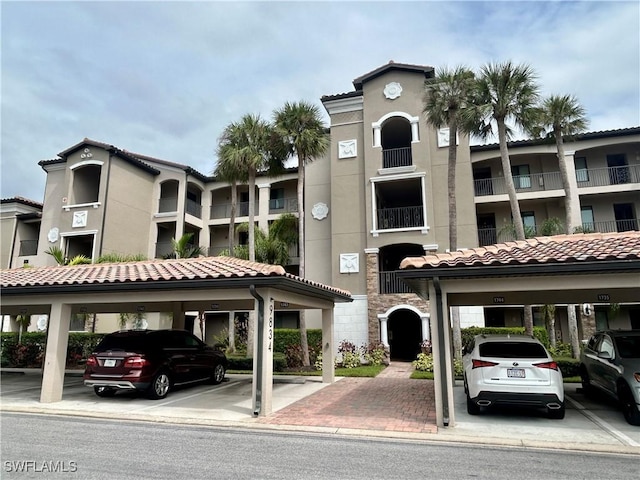 9834 Giaveno Cir Unit 1723, Naples, FL 34113 - view of property with covered parking