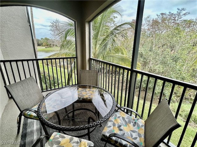 9834 Giaveno Cir Unit 1723, Naples, FL 34113 - balcony featuring outdoor dining area and a water view