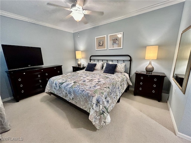 carpeted bedroom featuring ornamental molding and ceiling fan