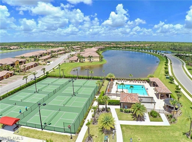 birds eye view of property with a water view