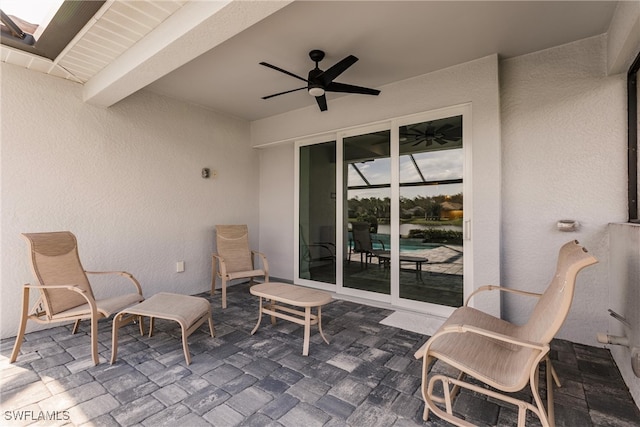 view of patio featuring ceiling fan