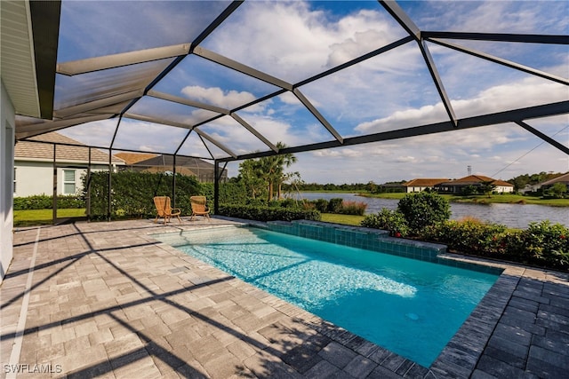 view of pool with a patio, a water view, and glass enclosure