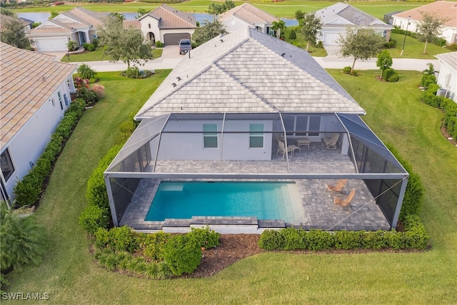 exterior space with a yard, a patio area, and a lanai