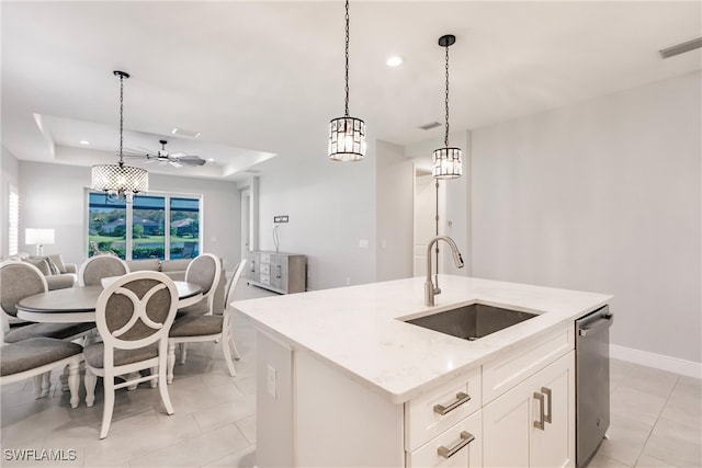 kitchen with dishwasher, hanging light fixtures, a center island with sink, sink, and white cabinetry