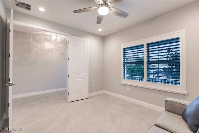 unfurnished room with ceiling fan