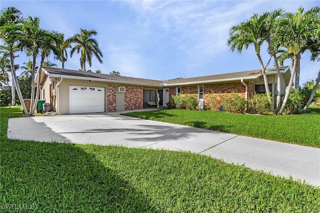 ranch-style home featuring a garage and a front lawn