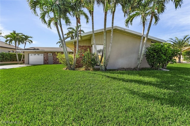 view of property exterior with a lawn and a garage