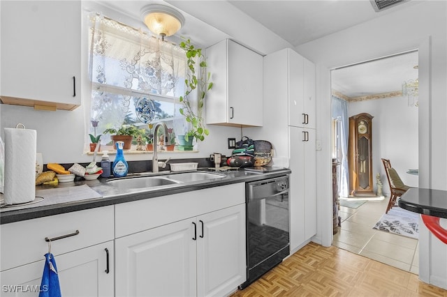 kitchen featuring white cabinetry, dishwasher, sink, and light tile patterned floors