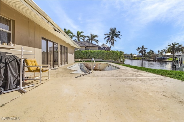 view of patio / terrace featuring a water view