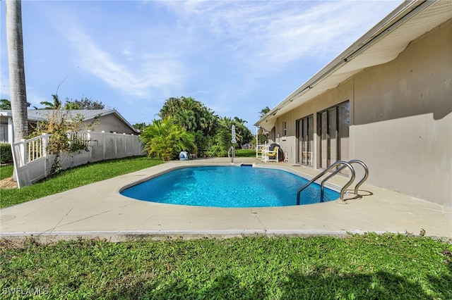 view of swimming pool with a patio