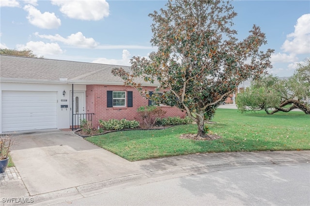 view of front of house with a front lawn and a garage