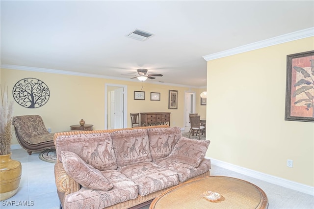 tiled living room featuring crown molding and ceiling fan