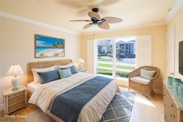 bedroom with light hardwood / wood-style floors, crown molding, and ceiling fan