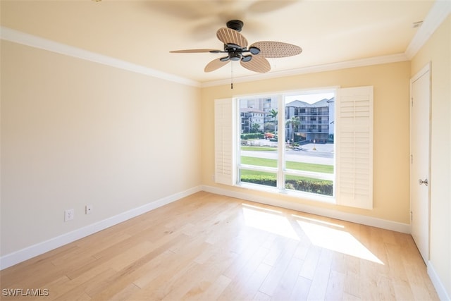 unfurnished room with ceiling fan, ornamental molding, and light wood-type flooring