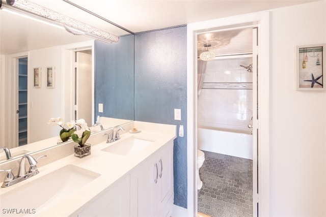 full bathroom featuring vanity, toilet, and combined bath / shower with glass door