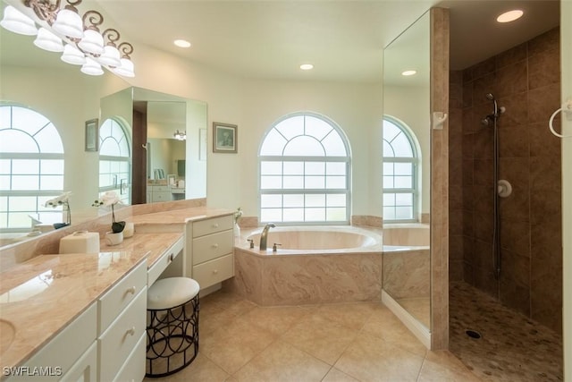 bathroom featuring vanity, tile patterned floors, and independent shower and bath