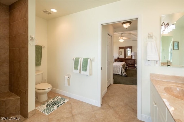 bathroom with tile patterned floors, ceiling fan, toilet, and vanity