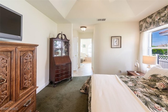 carpeted bedroom with ensuite bathroom