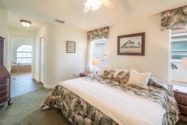 tiled bedroom featuring ceiling fan and a closet