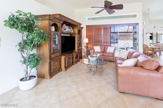 living room featuring ceiling fan and light tile patterned floors