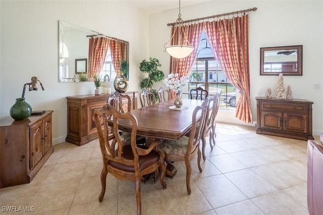 dining room featuring plenty of natural light and light tile patterned floors