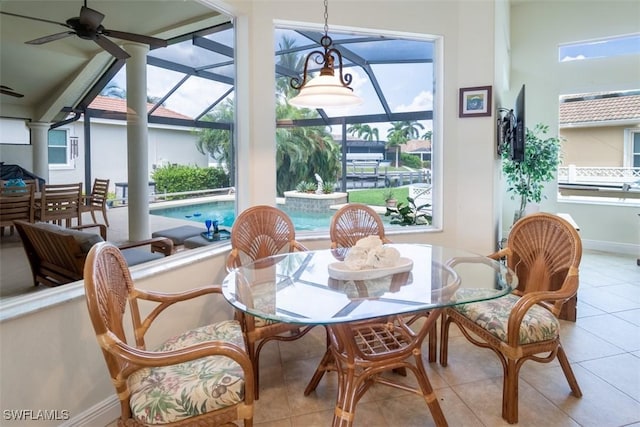 sunroom with a wealth of natural light and ceiling fan