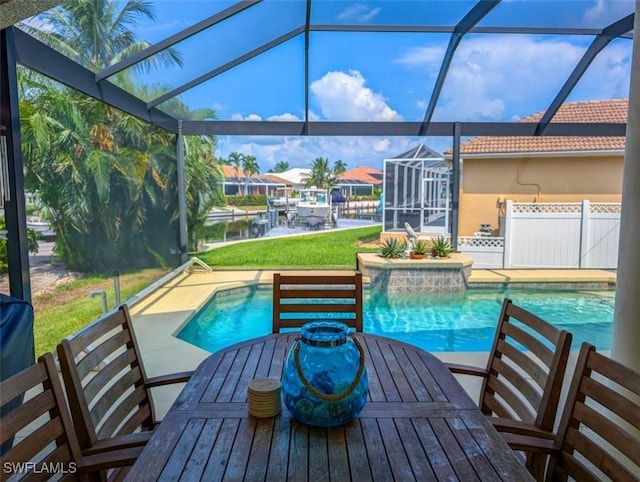 view of pool featuring a lanai, a patio area, and a water view