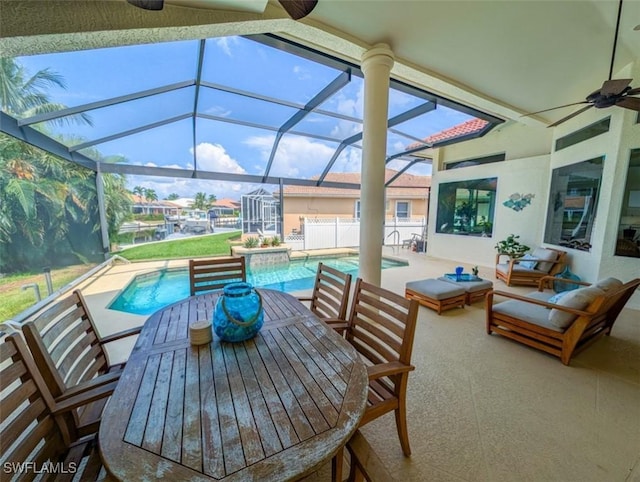 view of patio / terrace with glass enclosure and ceiling fan