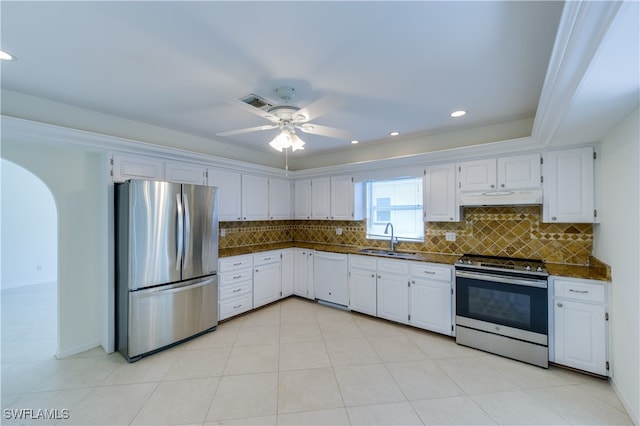 kitchen featuring white cabinetry, tasteful backsplash, appliances with stainless steel finishes, and sink